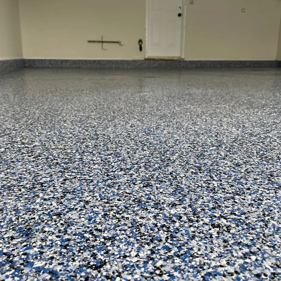 Blue, white and black flake epoxy garage floor coating by Naperville Painting & Epoxy Flooring