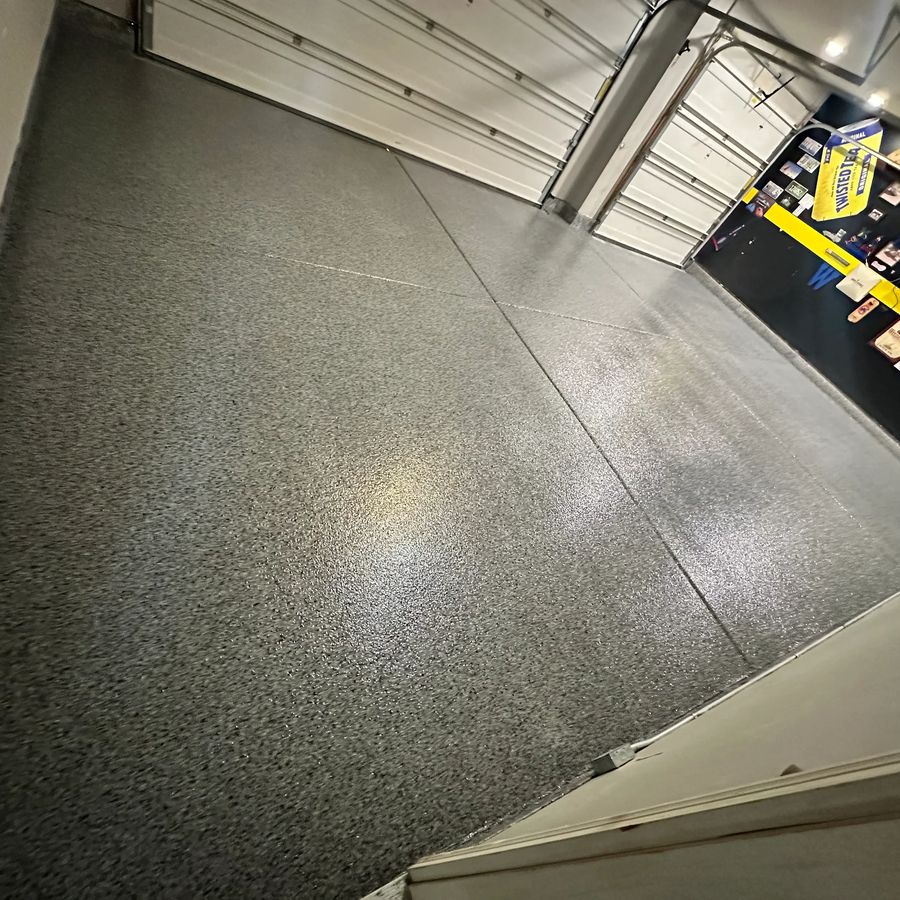 After epoxy: charcoal flake epoxy garage floor in a finished garage, by Naperville Painting & Epoxy Flooring