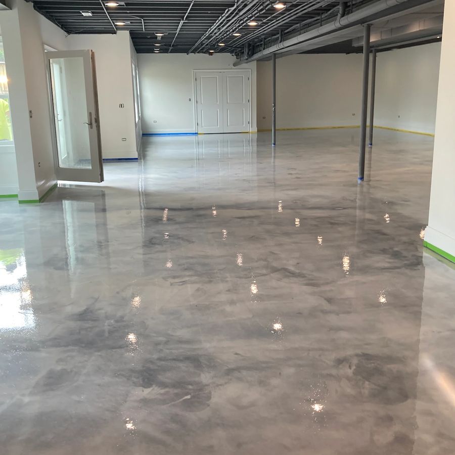 High-gloss silver metallic epoxy basement floor by Naperville Painting & Epoxy Flooring